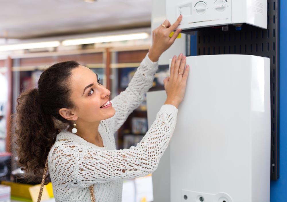 water heater units lined up, person choosing among them